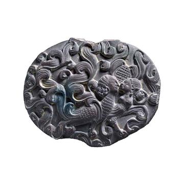 Box lid depicting a kinnara couple (mythic creatures – sometimes half-human and half-bird), EA2013.38 Carved box lid decorated with swirling motifs and two half-bird half-human figures