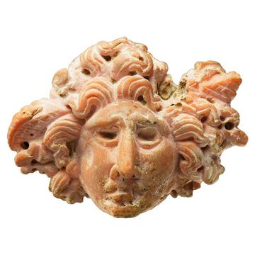 Carved stone in the form of the head of Medusa, EA1993.19 Carved stone in the form of the head of Medusa with snakes for hair