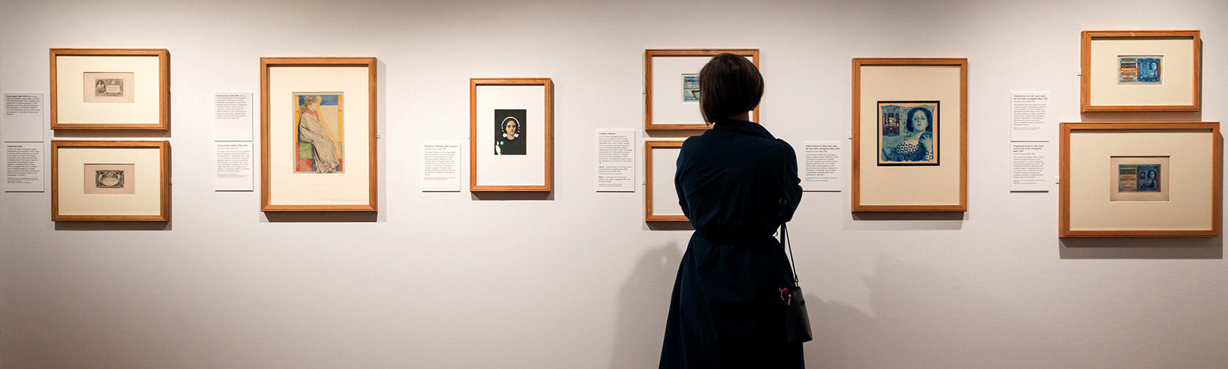 Art Nouveau banknotes wall with visitor Money Talks exhibition